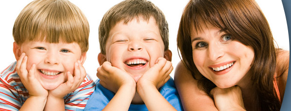 woman and young boys smiling