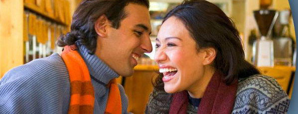 woman and man smiling and laughing